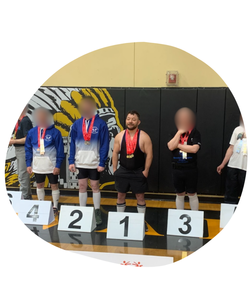 Tim lifting weights at the Special Olympics Powerlifting competition